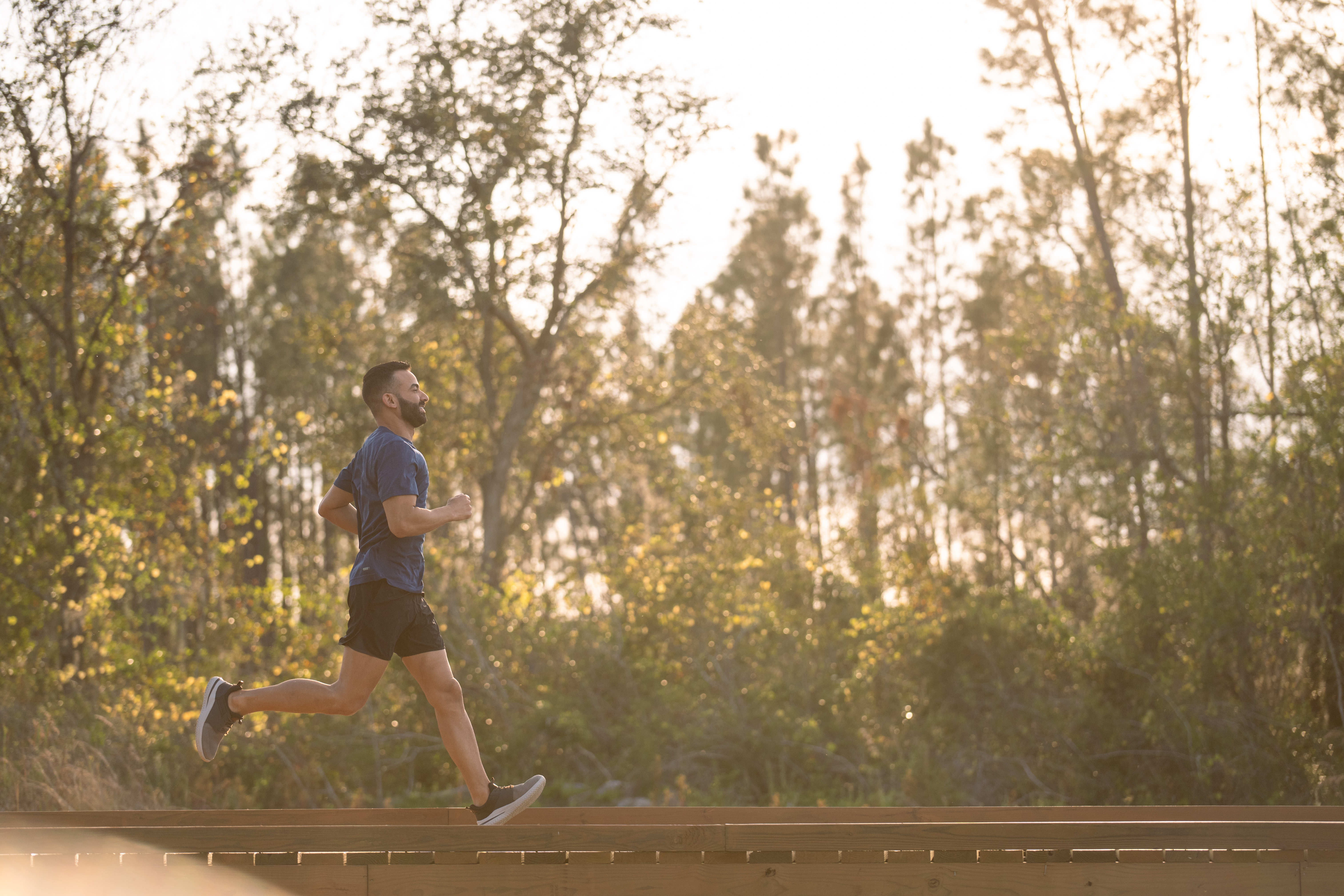 Man Running on Boardwalk