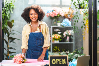 Woman selling flowers in her store